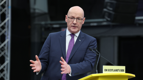 Man at podium giving speech