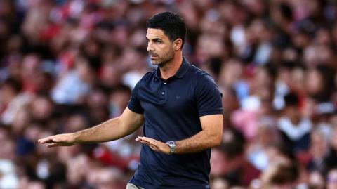 Mikel Arteta looks on