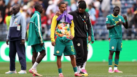 Iliman Ndiaye looking disappointed on the pitch after Senegal's World Cup exit