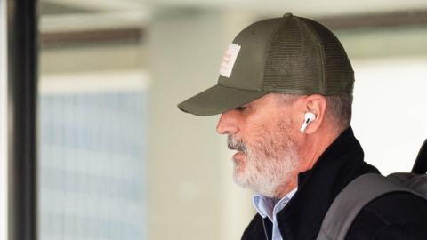 Roy Keane wearing a cap