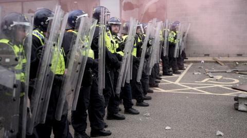 Riot police outside a Holiday Inn near Rotherham housing asylum seekers that was targeted during the disorder