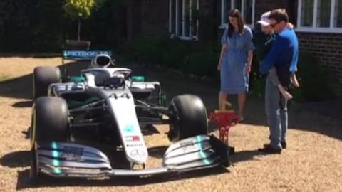 The Shaw family with the car