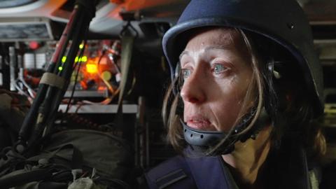 鶹Լ correspondent Lucy Williamson pictured inside an armoured vehicle during an embed with Israel Defense Forces (IDF) soldiers inside Gaza City (15 November 2023)