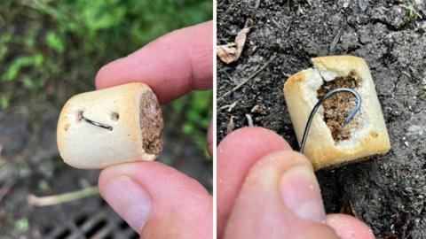 A composite image, on the left is a dog treat which has a biscuit outside. There is a sliver of metal visible poking out of the treat. On the right is a biscuit outer layer of a treat broken off to reveal the meat inside. A person is holding up a fish hook taken from within.