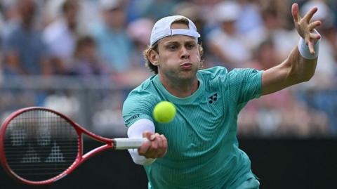Zizou Bergs plays a forehand in the Eastbourne final