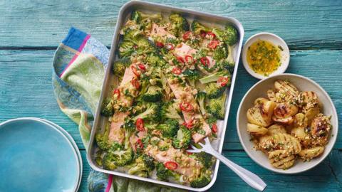 Steam-roasted salmon and broccoli with barbecued new potatoes.