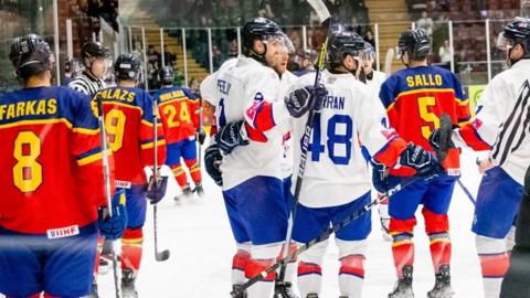 Great Britain celebrate their first goal against Romania scored by Brett Perlini