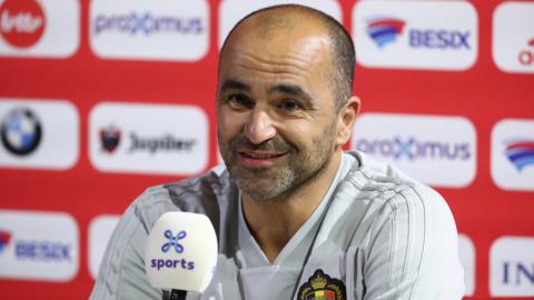 Belgium boss Roberto Martinez smiles at a news conference