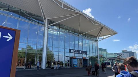 The entrance to the departure lounge at Bristol Airport on a sunny day