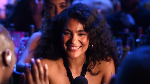 Pop singer Olivia Dean smiling