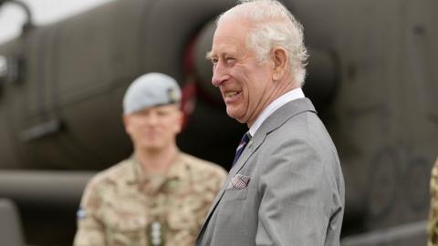 King Charles III speaks to service personnel, during a visit to the Army Aviation Centre at Middle Wallop, Hampshire