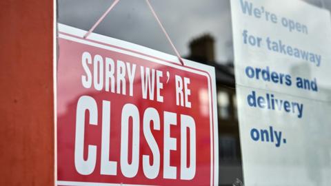 A closed sign in a shop window