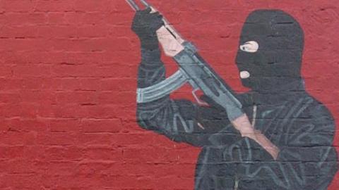 Paramilitary figure in mural