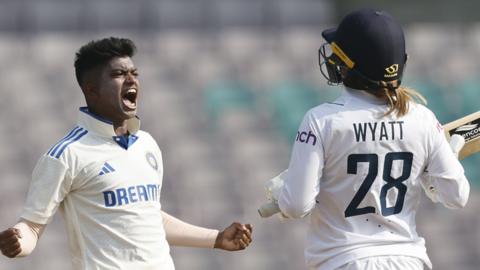India bowler Pooja Vastrakar (left) celebrates the wicket of England's Danni Wyatt (right)