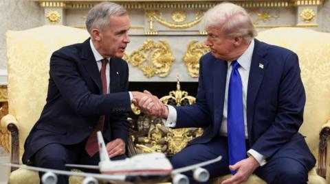 Mark Carney and Donald Trump shaking hands in Oval Office
