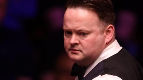 Shaun Murphy looks on