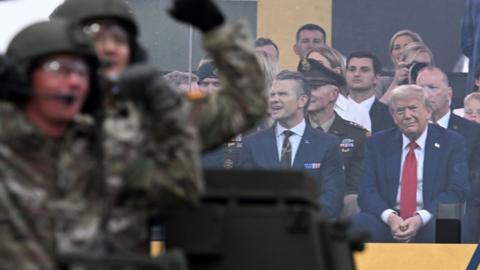 US President Trump looks at the military parade.