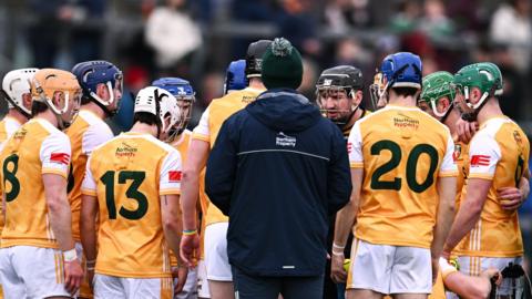 The Antrim squad huddle during a league match against Dublin in March