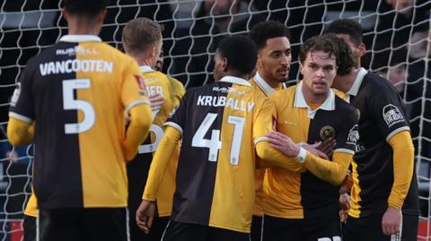 Burton players celebrate scoring against Boreham Wood