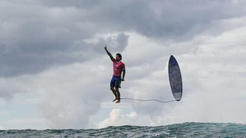 Brazil's Gabriel Medina reacts after getting a large wave in the 5th heat of the men's surfing round 3, during the Paris 2024 Olympic Games, in Teahupo'o, on the French Polynesian Island of Tahiti, on July 29, 2024.