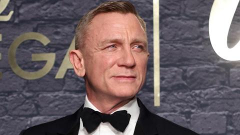 Daniel Craig in a suit as James Bond 