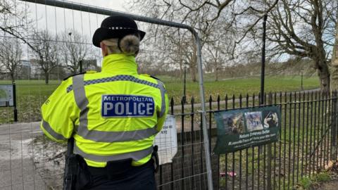 A Metropolitan Police officer at the scene of the fatal stabbing