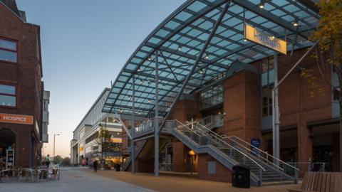 A modern glass and brick building. 