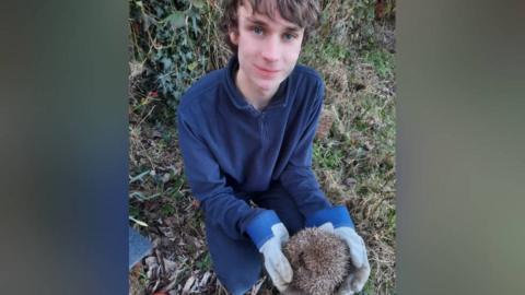 Dylan with a hedgehog