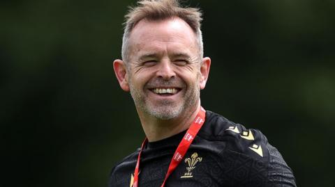 Danny Wilson smiling during Wales training