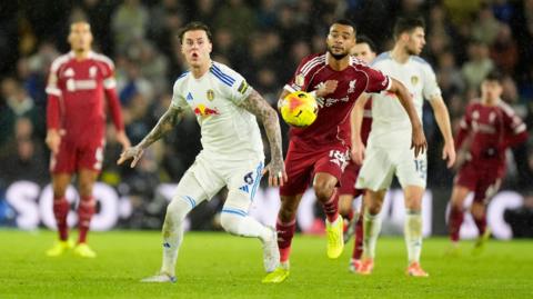 A Leeds player contests the ball alongside a Liverpool player at the match on 6 December where the incident took place. 