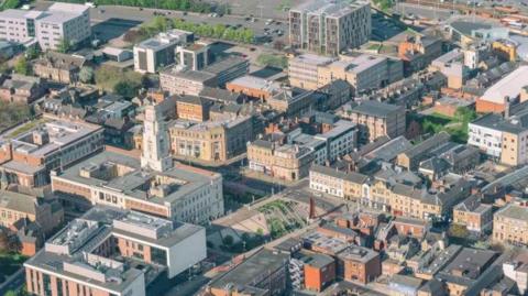 An aerial view of Barnsley shows dozens of homes, businesses and roads