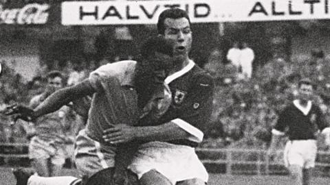 Pele in action against Wales' Mel Charles in 1958