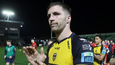 Steve Cummins applauds Dragons supporters at Rodney Parade
