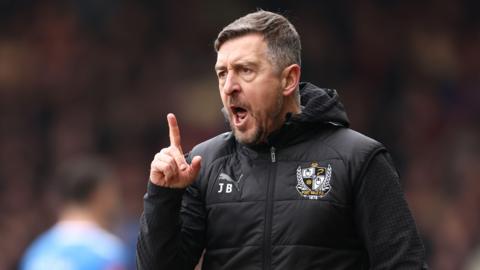 Port Vale boss Jon Brady on the touchline.