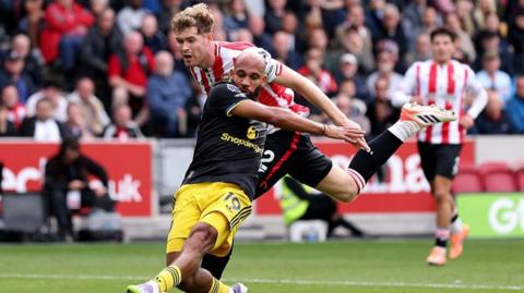 Manchester United striker Bryan Mbeumo is pulled back by Brentford defender Nathan Collins at the Gtech Community Stadium last month