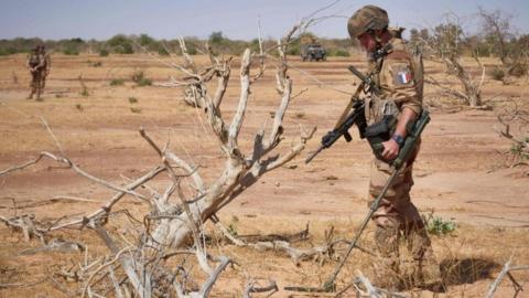 A French soldier clears mines in Burkina Faso