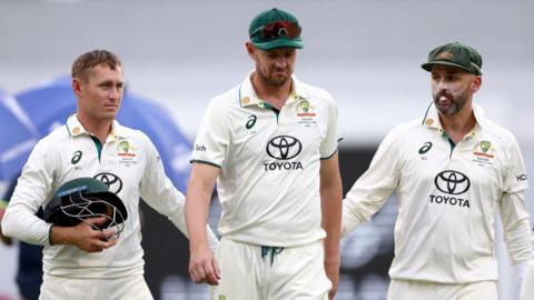 Australia's Josh Hazlewood walks off with a calf injury on day four of the third Test against India in Brisbane