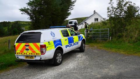 A police car outside a house