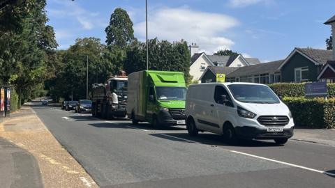 A general shot of Reigate Hill in Reigate with vans and cars in shot