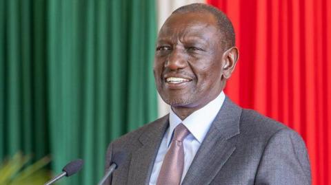 A close-up of President William Ruto in a suit and a tie 