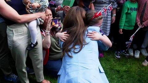 Princess of Wales hugs crying girl