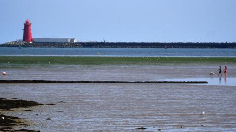 Dublin Bay, it is a blue sky and waves