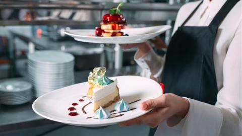 Waitress serving food