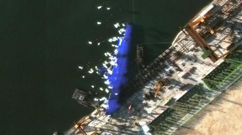 A handout satellite image made available by Maxar Technologies shows a new North Korean warship at the harbour 25 May 2025 after an accident during the launch ceremony in Chongjin, North Korea, 21 May