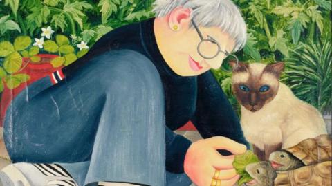 This is Beryl Cook's self-portrait Feeding the Tortoises, which is featured in the 2026 Plymouth exhibition. The image is of a woman with short grey hair, wearing jeans with white sandals and striped socks. She is feeding two tortoises, called Hercule and Desiree, with leaves. The tortoises are watched by a cat with blue eyes. 