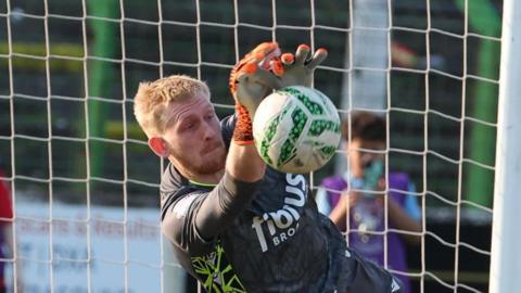 Coleraine keeper Ryan Schofield saves Pat Hoban's penalty 