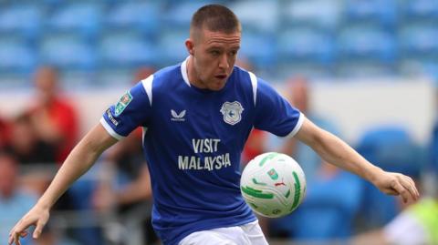 Jack Moylan of Cardiff City with the ball