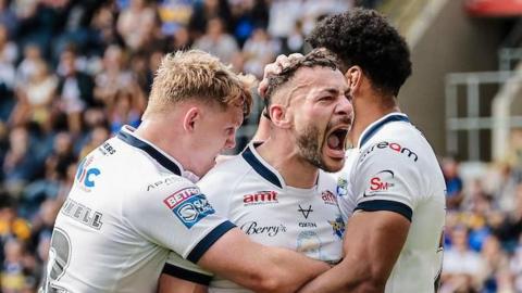 Leeds Rhinos player Jake Connor shouts in celebration after scoring a try against Wakefield Trinity