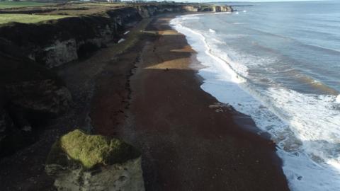 Drone shot of coastline and erosion