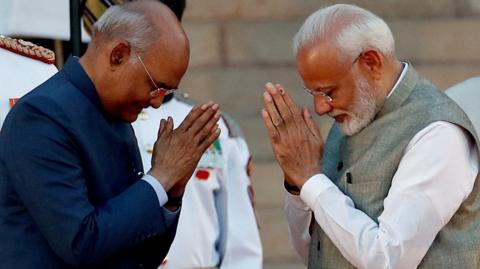 India's President Ram Nath Kovind greets India"s Prime Minister Narendra Modi after his oath during a swearing-in ceremony at the presidential palace in New Delhi, India May 30, 2019